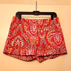 Shorts in orange and yellow multi-patterned design.